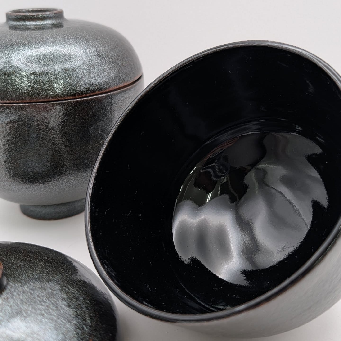 Glossy black lidded jar and bowl